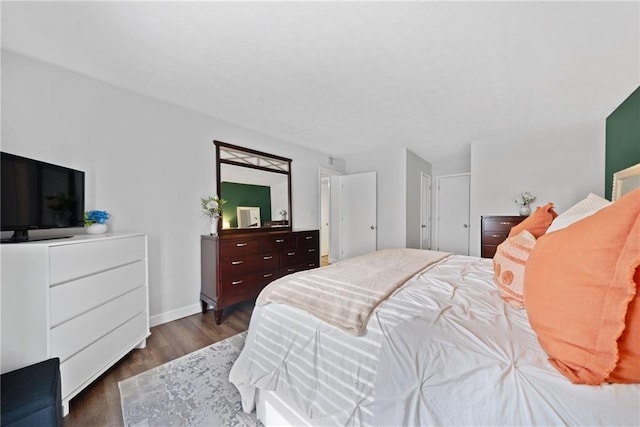 bedroom featuring dark hardwood / wood-style flooring