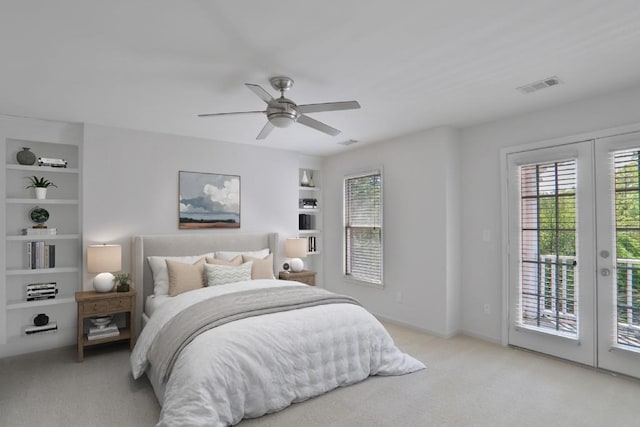 carpeted bedroom featuring french doors, access to exterior, and ceiling fan