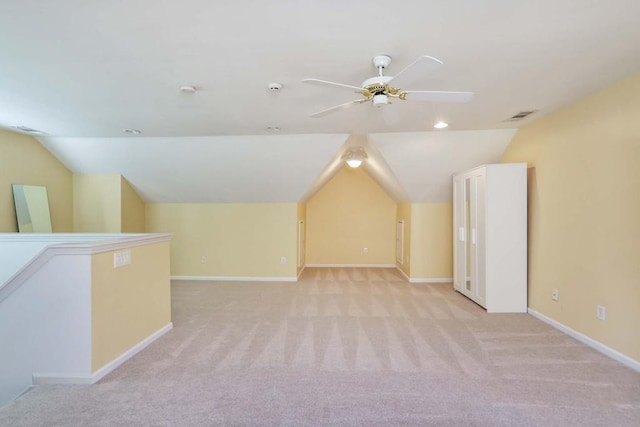 bonus room featuring ceiling fan, light colored carpet, and vaulted ceiling