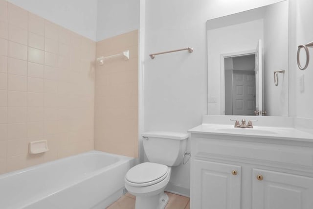 full bathroom featuring tiled shower / bath combo, vanity, and toilet