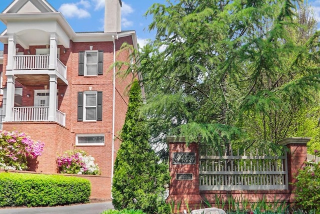 view of front of home featuring a balcony