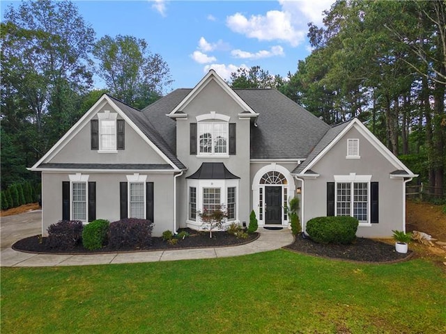 view of property featuring a front yard