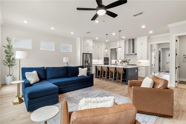 228 Idylwilde Way, Canton, GA 30115 - living room with visible vents, a ceiling fan, crown molding, recessed lighting, and light wood-style flooring