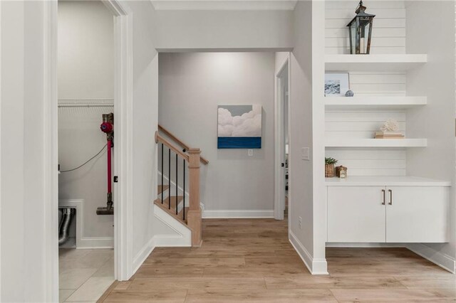 228 Idylwilde Way, Canton, GA 30115 - foyer with light wood-style flooring, baseboards, and stairs