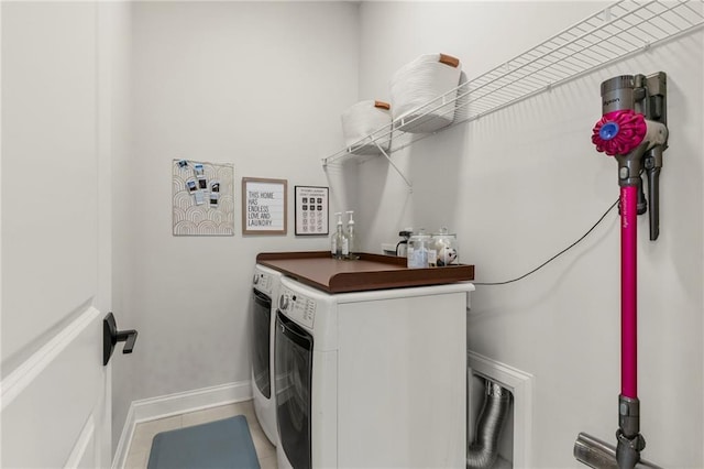 228 Idylwilde Way, Canton, GA 30115 - clothes washing area with baseboards, light tile patterned floors, washer and clothes dryer, and laundry area
