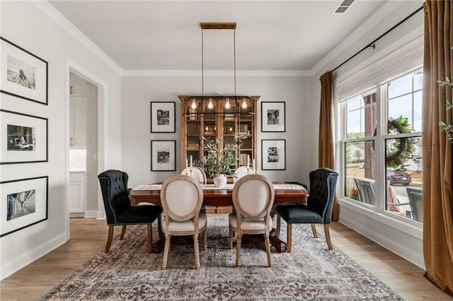 228 Idylwilde Way, Canton, GA 30115 - dining space featuring crown molding, visible vents, and wood finished floors