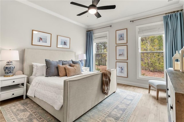 228 Idylwilde Way, Canton, GA 30115 - bedroom featuring baseboards, light wood-style floors, multiple windows, and crown molding