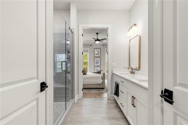228 Idylwilde Way, Canton, GA 30115 - bathroom with double vanity, ensuite bathroom, a ceiling fan, a shower stall, and a sink