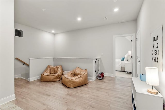 228 Idylwilde Way, Canton, GA 30115 - sitting room featuring light wood-style flooring, an upstairs landing, visible vents, and recessed lighting