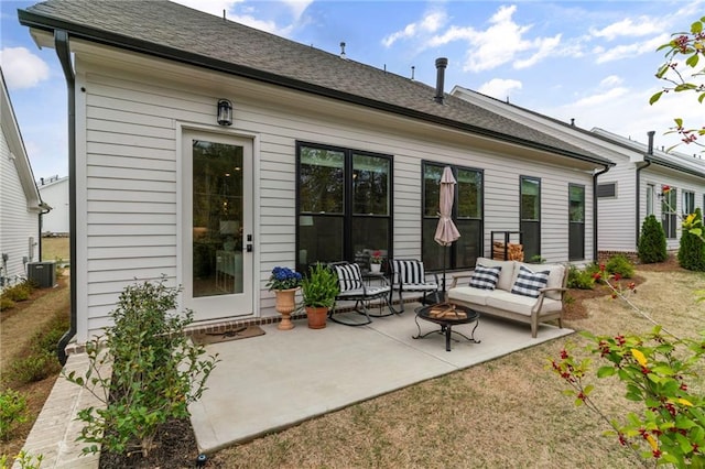 228 Idylwilde Way, Canton, GA 30115 - back of property featuring a patio, roof with shingles, central air condition unit, and an outdoor living space with a fire pit