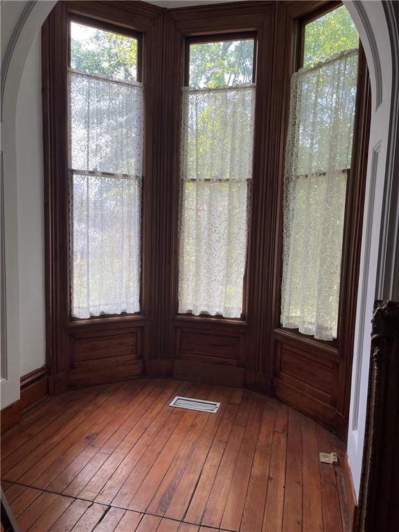 unfurnished sunroom featuring a wealth of natural light