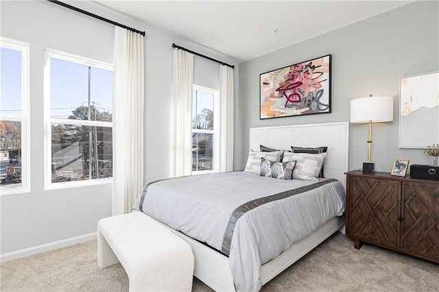 339 Skylar Way SE, Atlanta, GA 30315 - carpeted bedroom featuring multiple windows and baseboards