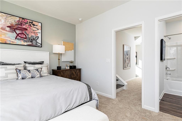 339 Skylar Way SE, Atlanta, GA 30315 - carpeted bedroom featuring baseboards and ensuite bath