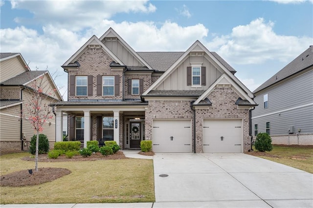 craftsman-style home featuring a garage and a front lawn