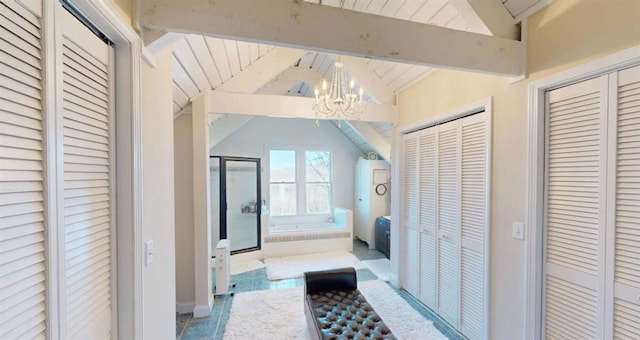 bathroom with lofted ceiling with beams, a notable chandelier, a closet, and a shower stall