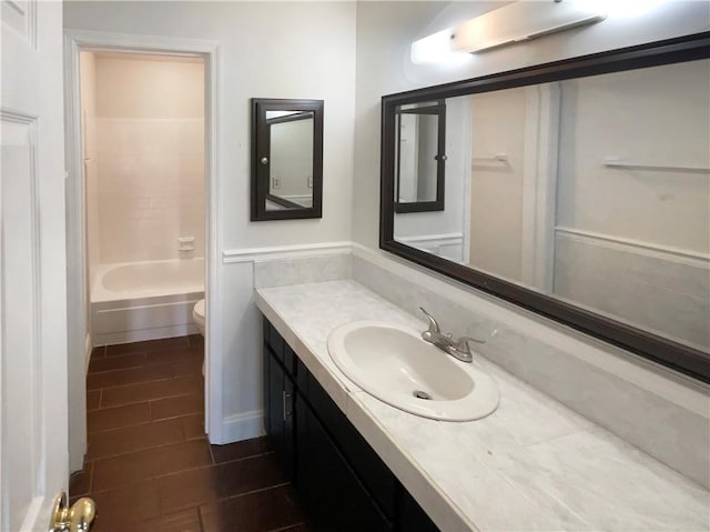 full bathroom featuring tile patterned floors, vanity, shower / bath combination, and toilet