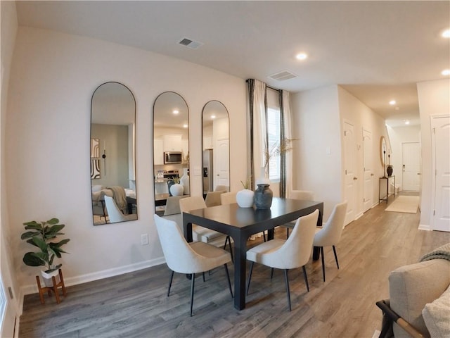 dining area featuring wood-type flooring