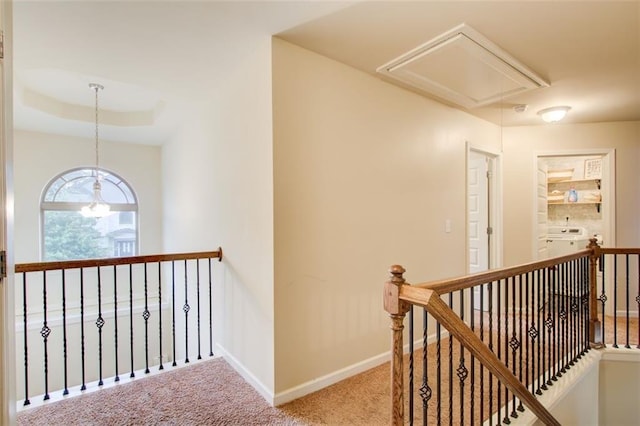 3746 Okefenokee Rdg, Loganville, GA 30052 - corridor featuring attic access, an upstairs landing, carpet flooring, and washer / clothes dryer