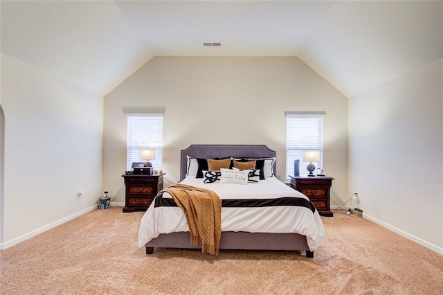 3746 Okefenokee Rdg, Loganville, GA 30052 - bedroom featuring light colored carpet, multiple windows, baseboards, and lofted ceiling