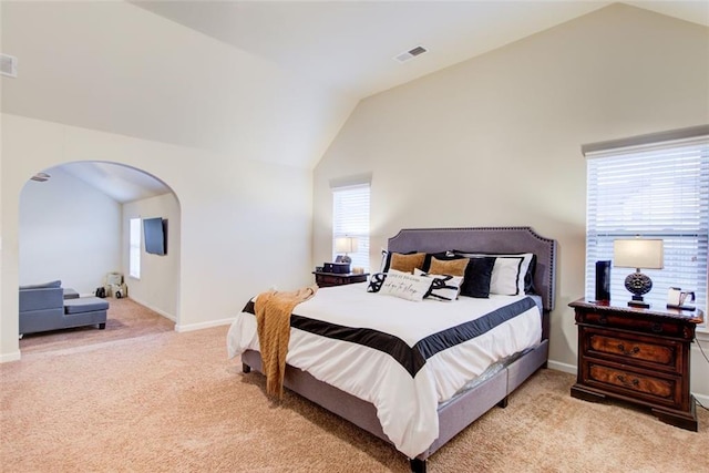 3746 Okefenokee Rdg, Loganville, GA 30052 - carpeted bedroom featuring lofted ceiling, arched walkways, and baseboards