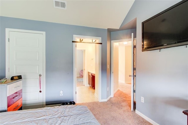 3746 Okefenokee Rdg, Loganville, GA 30052 - bedroom with light colored carpet, baseboards, lofted ceiling, and connected bathroom