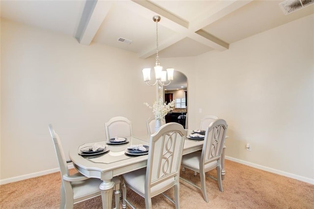 3746 Okefenokee Rdg, Loganville, GA 30052 - dining room featuring beamed ceiling, carpet floors, a chandelier, and baseboards