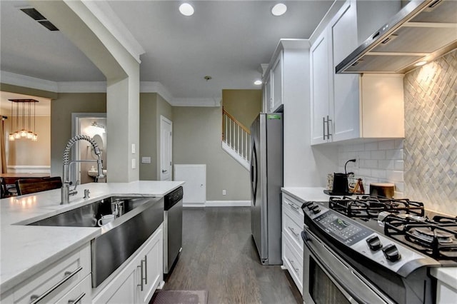 2515 Gadsen Walk, Duluth, GA 30097 - kitchen featuring stainless steel appliances, exhaust hood, decorative backsplash, dark wood-style floors, and white cabinets
