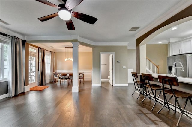 2515 Gadsen Walk, Duluth, GA 30097 - dining room featuring crown molding, dark wood-style floors, ceiling fan, stairs, and recessed lighting