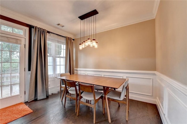 2515 Gadsen Walk, Duluth, GA 30097 - dining area with healthy amount of natural light, crown molding, dark wood-type flooring, and a wainscoted wall