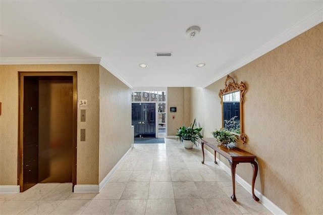 hallway featuring ornamental molding and elevator