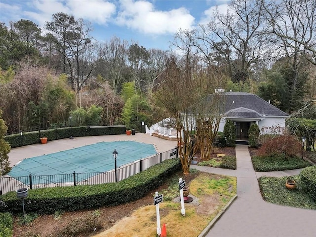 view of swimming pool featuring a patio area