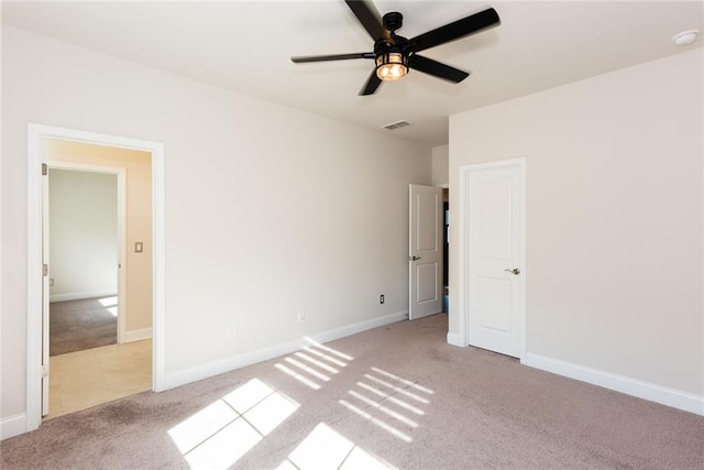 unfurnished bedroom with ceiling fan and light colored carpet