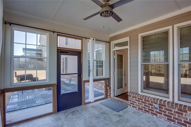 entryway featuring crown molding and ceiling fan