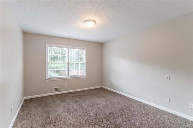 803 Cedar Lake Dr SE, Conyers, GA 30094 - carpeted empty room featuring a textured ceiling and baseboards