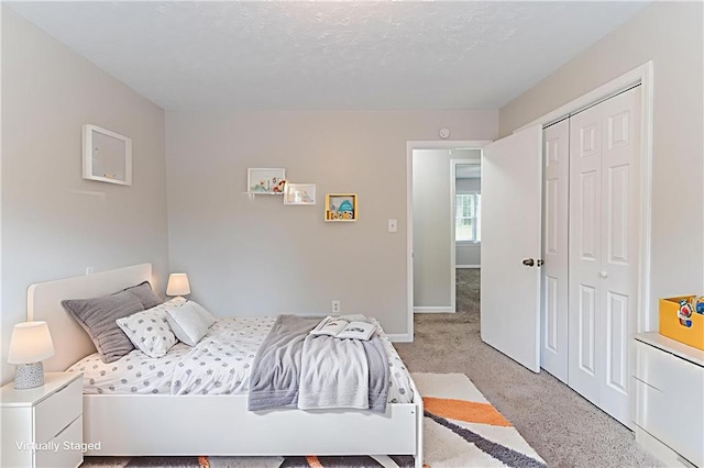 803 Cedar Lake Dr SE, Conyers, GA 30094 - bedroom featuring light carpet, baseboards, and a closet