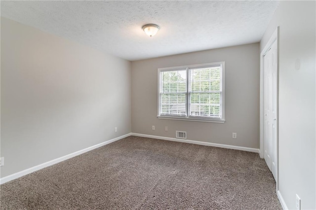 803 Cedar Lake Dr SE, Conyers, GA 30094 - unfurnished room featuring carpet floors, a textured ceiling, and baseboards