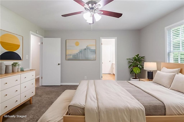 803 Cedar Lake Dr SE, Conyers, GA 30094 - carpeted bedroom featuring ensuite bath, baseboards, and a ceiling fan