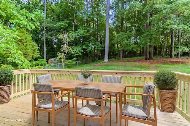 803 Cedar Lake Dr SE, Conyers, GA 30094 - deck featuring outdoor dining space, view of scattered trees, and a lawn