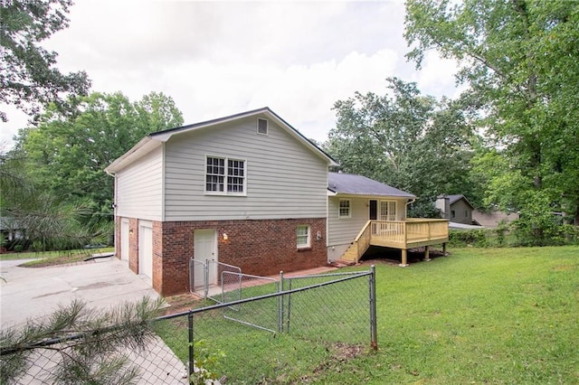 803 Cedar Lake Dr SE, Conyers, GA 30094 - back of house with brick siding, a wooden deck, concrete driveway, an attached garage, and stairs
