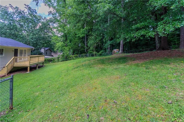 803 Cedar Lake Dr SE, Conyers, GA 30094 - view of yard with a wooden deck, stairs, and view of wooded area