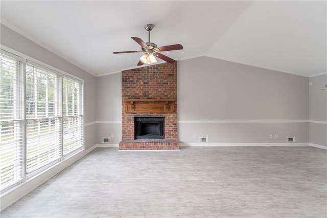 803 Cedar Lake Dr SE, Conyers, GA 30094 - unfurnished living room featuring ceiling fan, light wood-style flooring, vaulted ceiling, a fireplace, and baseboards