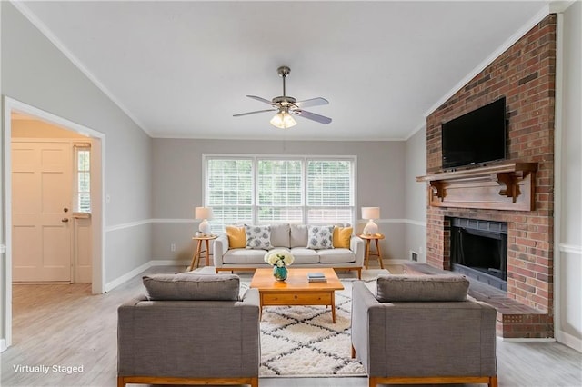 803 Cedar Lake Dr SE, Conyers, GA 30094 - living area with ornamental molding, light wood finished floors, ceiling fan, baseboards, and a brick fireplace
