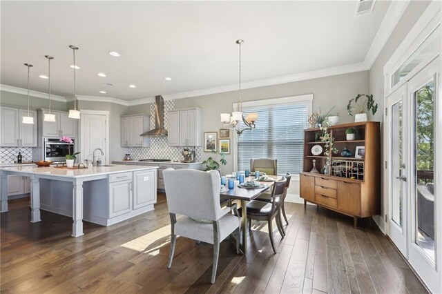 living area featuring crown molding, ceiling fan, and dark wood-style floors