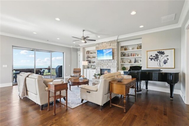 living area with dark wood-style flooring, ceiling fan, and ornamental molding
