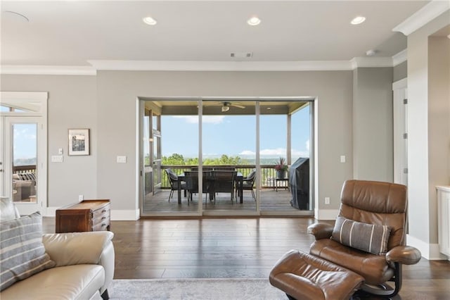 living area with recessed lighting, ceiling fan, ornamental molding, and hardwood / wood-style floors