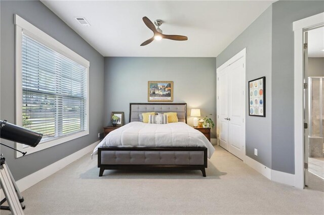 bedroom with carpet floors, a ceiling fan, baseboards, and visible vents