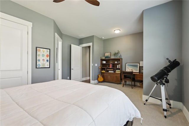 bedroom featuring a ceiling fan, baseboards, and light colored carpet