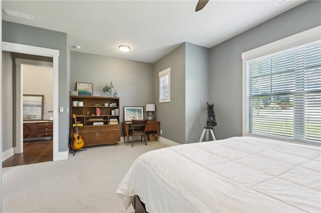 carpeted bedroom with baseboards and ceiling fan