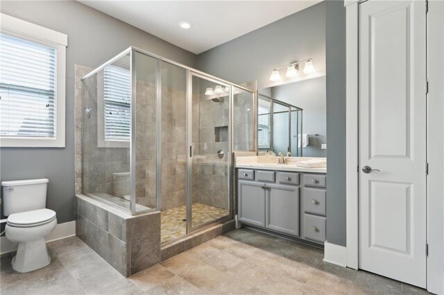 bathroom with vanity, shower / bath combo, toilet, and visible vents