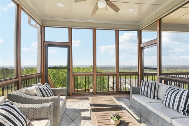 sunroom featuring ceiling fan and outdoor lounge area